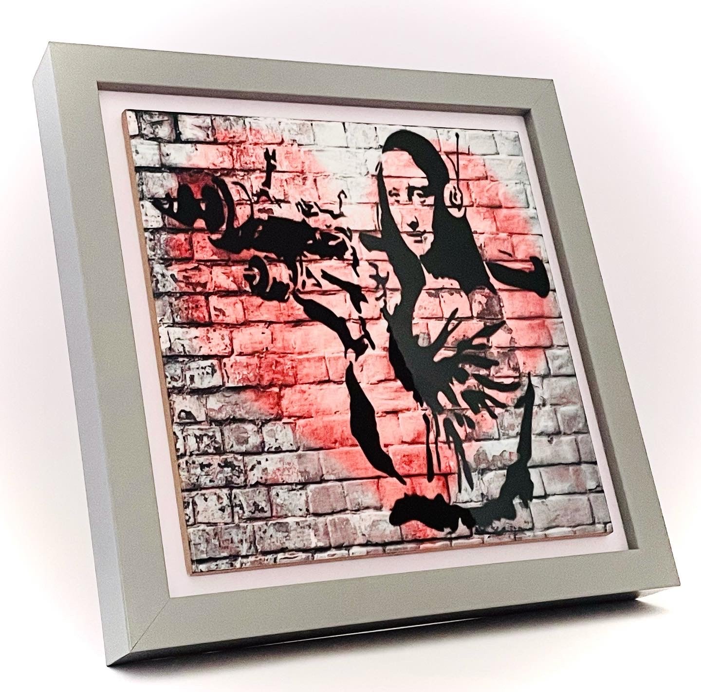 Banksy ceramic tile art.